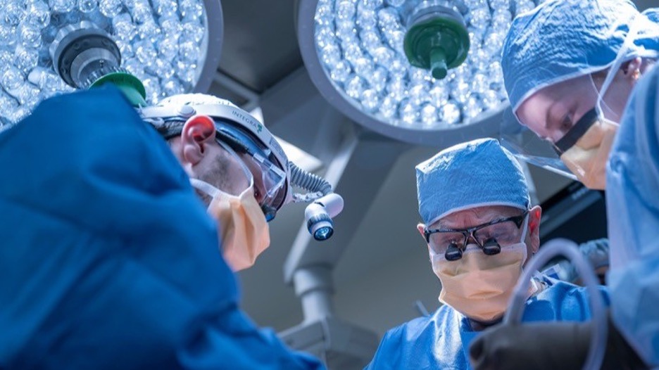 Doctors working with a patient